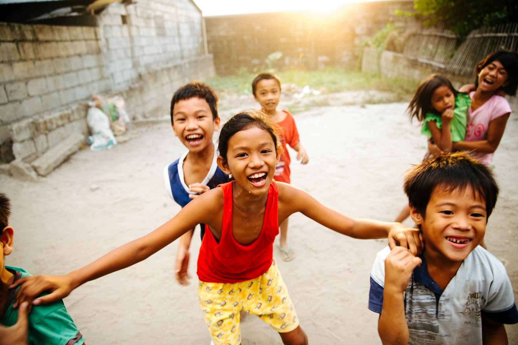 Happy kids playing and laughing together outdoors